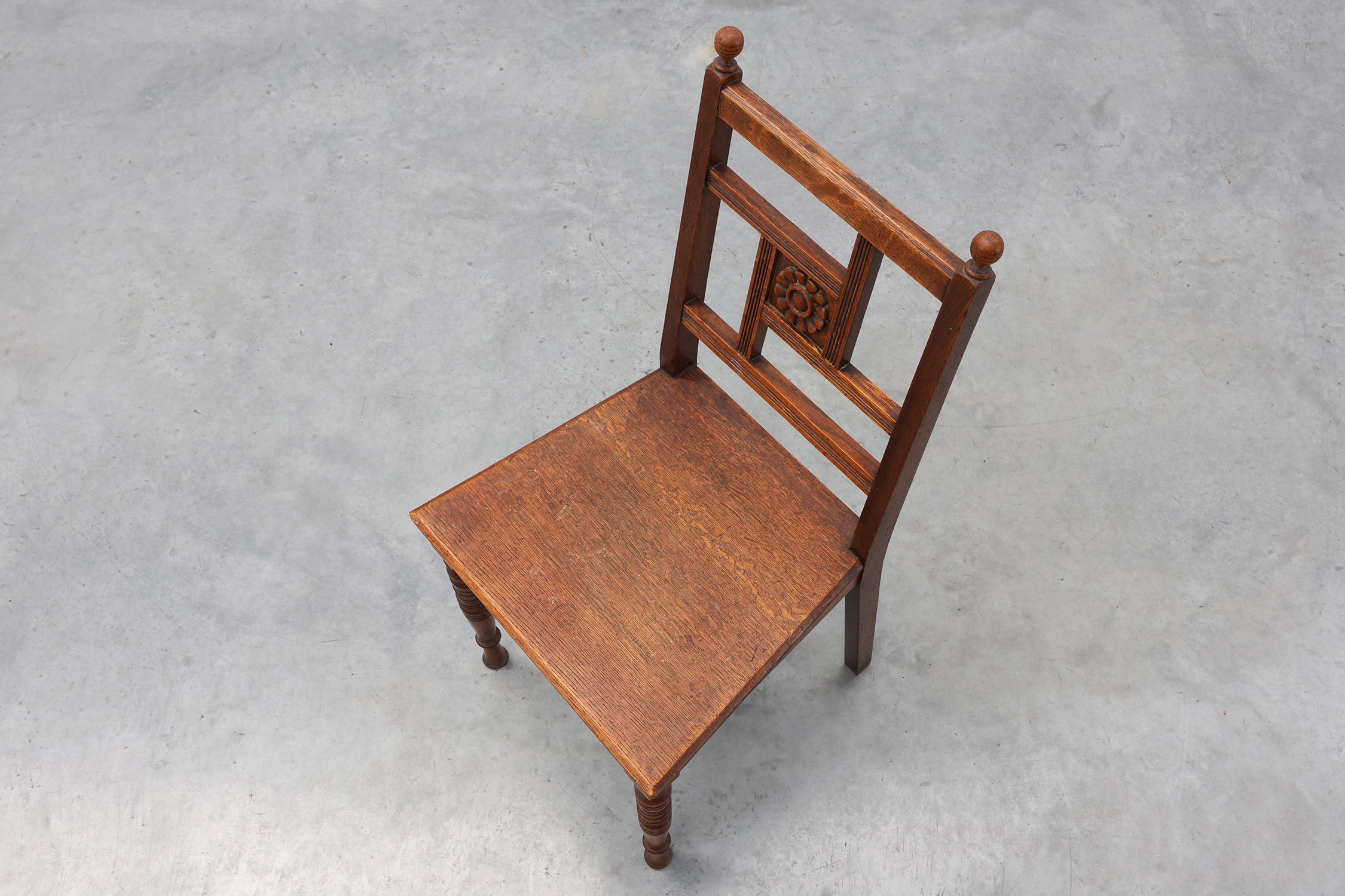 Art Deco oak side chair with carved rosette back and turned front legs, Belgium ca. 1915thumbnail
